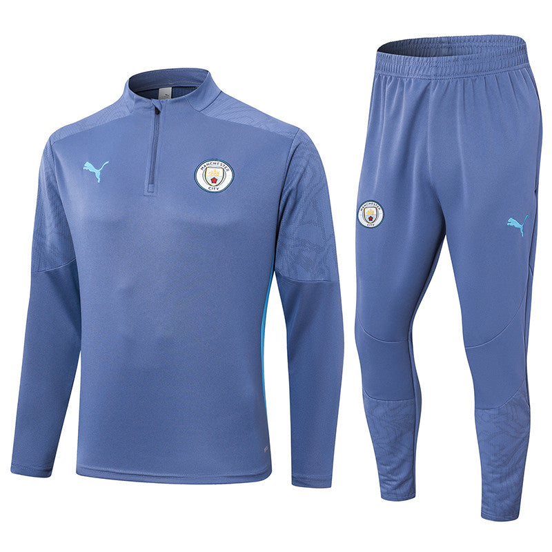 Manchester City 1/4 Zip Tracksuit 24/25 - Luminous Blue
